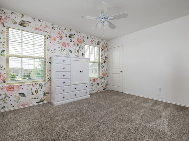 752 Circle Way Unit 35H, Jarrell, TX 76537 - unfurnished bedroom featuring wallpapered walls, carpet floors, and a ceiling fan
