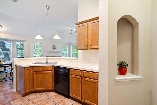 1601 Muledeer Run, Leander, TX 78641 - kitchen with dishwasher, a peninsula, light countertops, light tile patterned floors, and backsplash