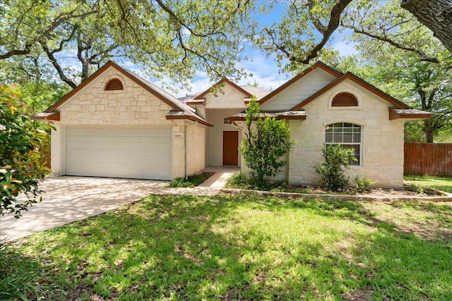 1601 Muledeer Run, Leander, TX 78641 - view of front of property with an attached garage, stone siding, and driveway