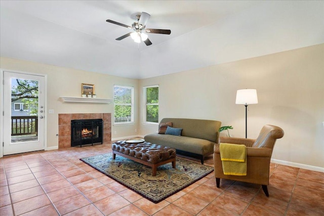 1601 Muledeer Run, Leander, TX 78641 - tiled living room with healthy amount of natural light, a ceiling fan, and a fireplace