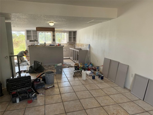161 Fm 1209, Cedar Creek, TX 78612 - dining space with light tile patterned floors, plenty of natural light, and a textured ceiling