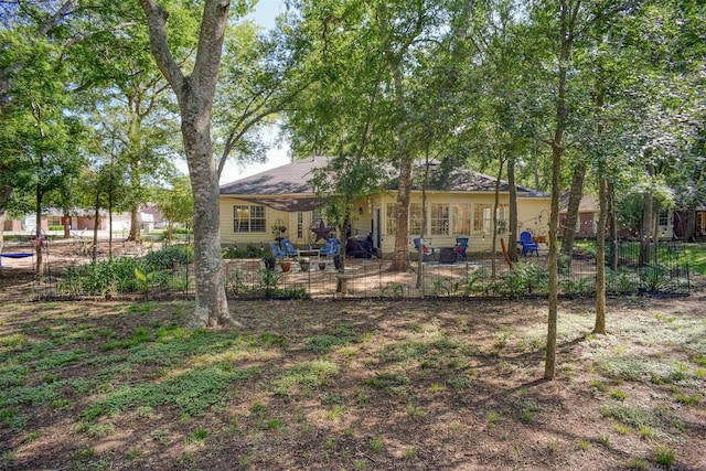 128 Moku Manu Dr, Bastrop, TX 78602 - rear view of property featuring a patio area