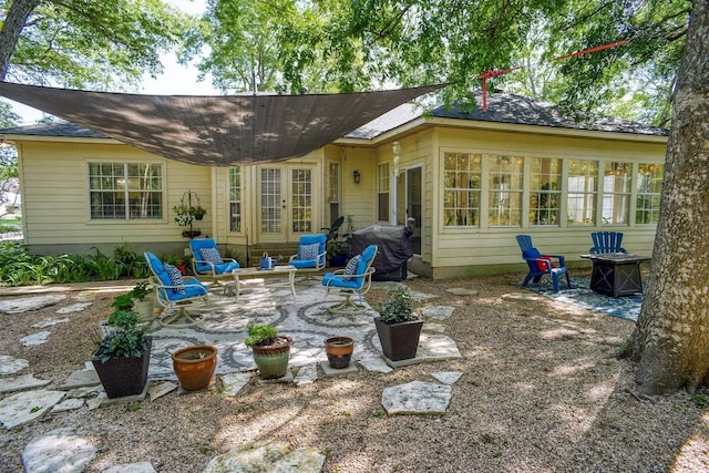128 Moku Manu Dr, Bastrop, TX 78602 - rear view of property with a patio area
