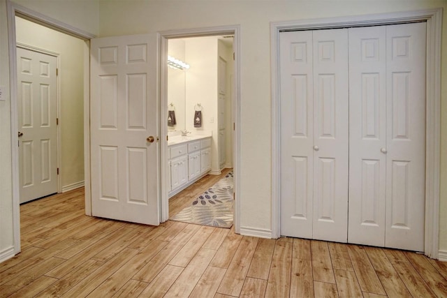128 Moku Manu Dr, Bastrop, TX 78602 - unfurnished bedroom featuring light wood finished floors and a closet