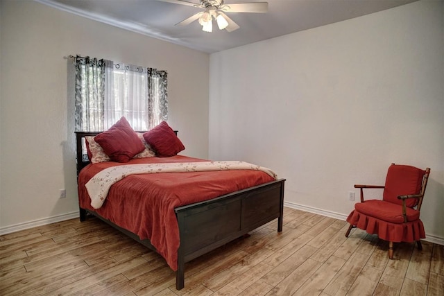 128 Moku Manu Dr, Bastrop, TX 78602 - bedroom with light wood-style flooring and ceiling fan