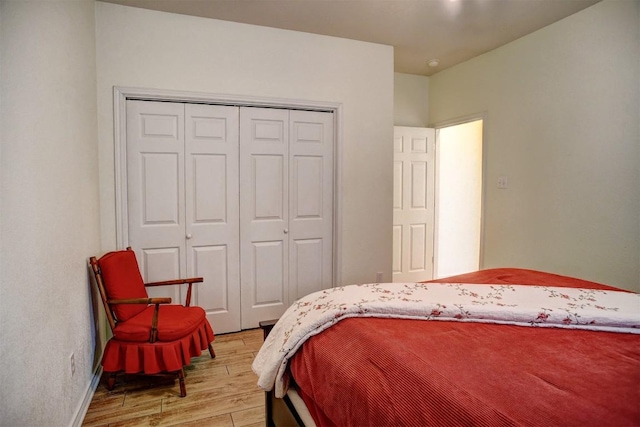 128 Moku Manu Dr, Bastrop, TX 78602 - bedroom featuring light wood-type flooring and a closet