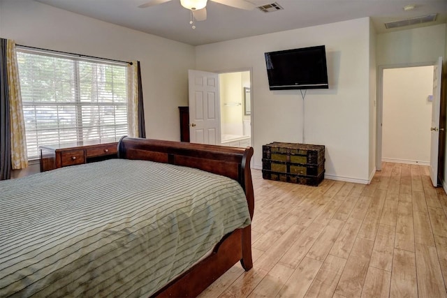 128 Moku Manu Dr, Bastrop, TX 78602 - bedroom featuring light wood-style floors and ceiling fan