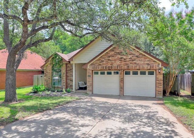 5907 Shanghai Pierce Rd, Austin, TX 78749 - view of front of property with brick siding, driveway, and an attached garage