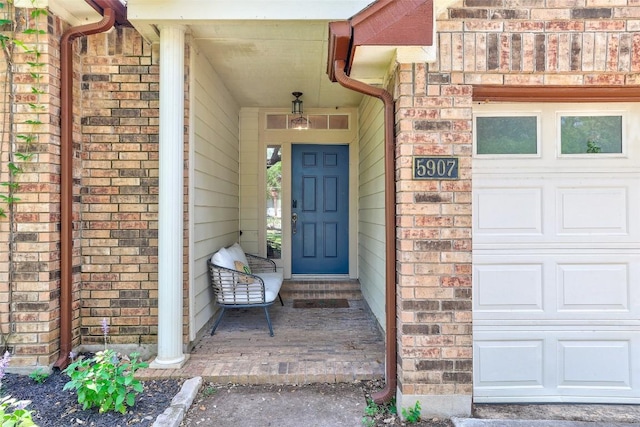 5907 Shanghai Pierce Rd, Austin, TX 78749 - doorway to property with brick siding and a garage