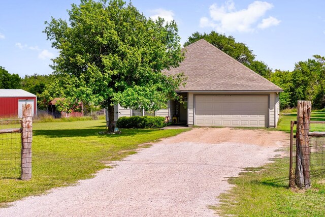251 Barton Meadow Dr, Dripping Springs, TX 78620 - view of property hidden behind natural elements featuring gravel driveway, a shingled roof, and an attached garage