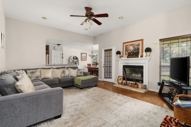 251 Barton Meadow Dr, Dripping Springs, TX 78620 - living room featuring ceiling fan, a glass covered fireplace, wood finished floors, and recessed lighting