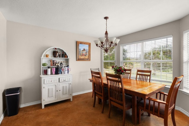 251 Barton Meadow Dr, Dripping Springs, TX 78620 - dining room with a chandelier and baseboards