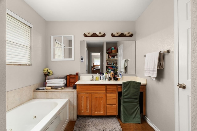 251 Barton Meadow Dr, Dripping Springs, TX 78620 - bathroom with a tub with jets and vanity
