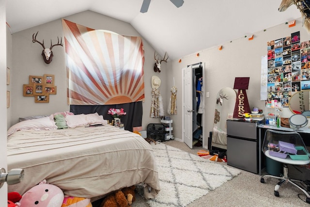 251 Barton Meadow Dr, Dripping Springs, TX 78620 - carpeted bedroom with lofted ceiling, freestanding refrigerator, and a ceiling fan