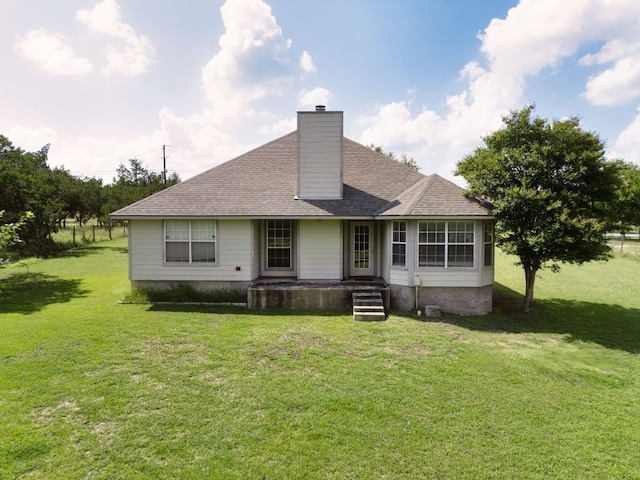 251 Barton Meadow Dr, Dripping Springs, TX 78620 - back of house featuring a chimney, a yard, and a shingled roof