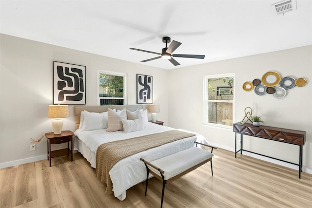 1806 Teton Dr, Austin, TX 78757 - bedroom with multiple windows, light wood-type flooring, and ceiling fan