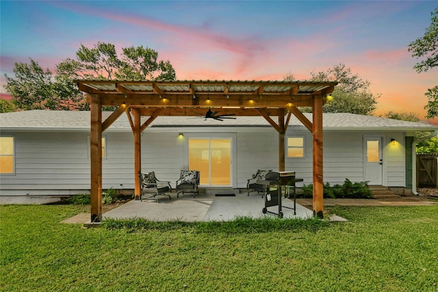 1806 Teton Dr, Austin, TX 78757 - back of house at dusk with ceiling fan, a lawn, a patio area, and a pergola