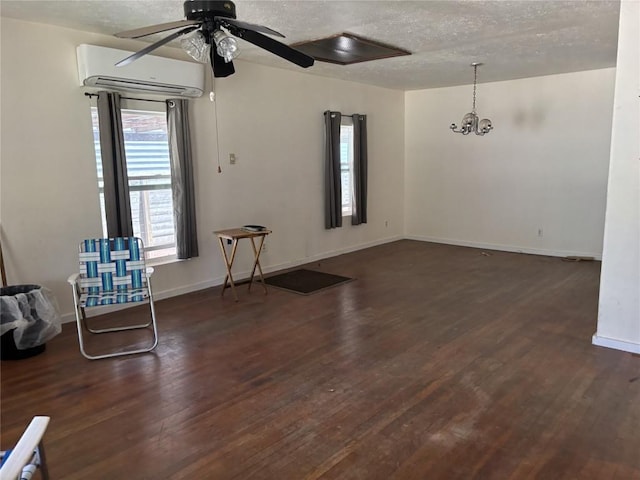 2503 S 4th St, Austin, TX 78704 - unfurnished room with an AC wall unit, a textured ceiling, dark wood-type flooring, and ceiling fan