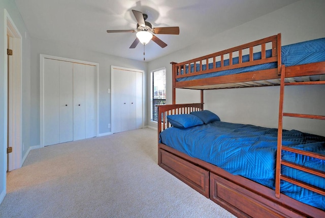 13109, 13111 Mansfield Dr Dr, Austin, TX 78732 - carpeted bedroom with multiple closets and ceiling fan