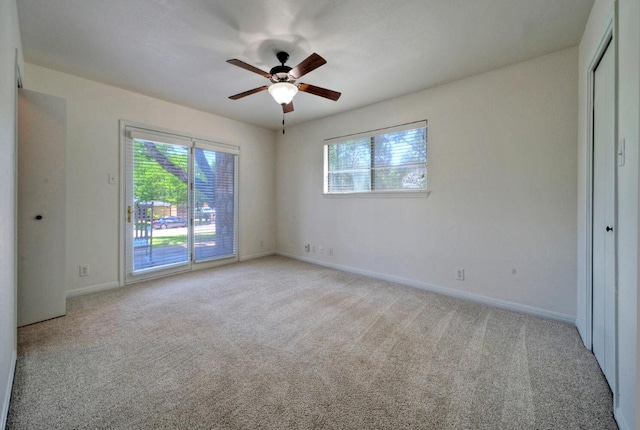 13109, 13111 Mansfield Dr Dr, Austin, TX 78732 - spare room featuring plenty of natural light, a ceiling fan, and light colored carpet
