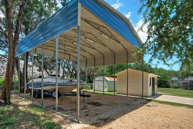 13109, 13111 Mansfield Dr Dr, Austin, TX 78732 - view of parking featuring a storage shed and a carport