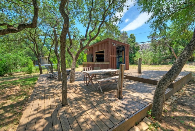 13109, 13111 Mansfield Dr Dr, Austin, TX 78732 - deck with outdoor dining space and an outbuilding