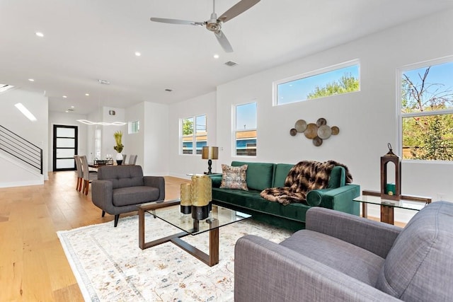 1719 Bunche Rd, Austin, TX 78721 - living area featuring healthy amount of natural light, recessed lighting, light wood finished floors, and ceiling fan