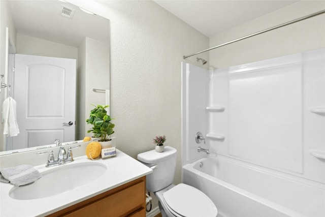 225 Hobby St, Georgetown, TX 78633 - full bathroom featuring vanity, washtub / shower combination, and a textured wall