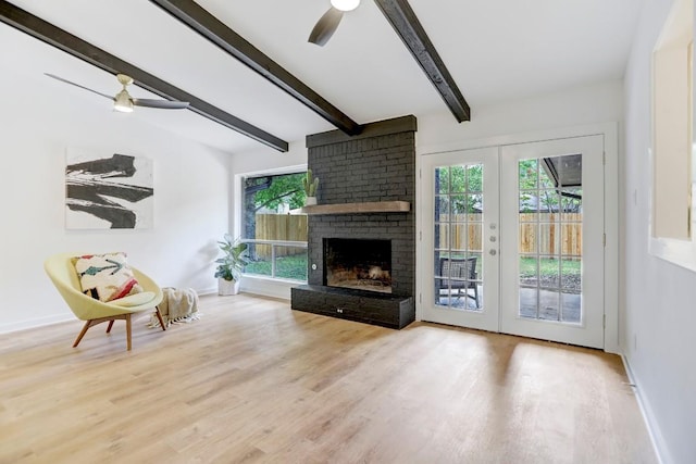 10206 Cripple Creek Cv, Austin, TX 78758 - living area featuring ceiling fan, healthy amount of natural light, wood finished floors, and beam ceiling