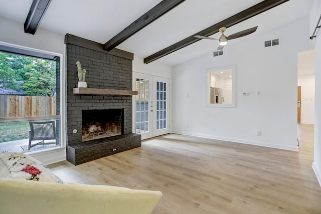 10206 Cripple Creek Cv, Austin, TX 78758 - unfurnished living room with ceiling fan, wood finished floors, and a fireplace
