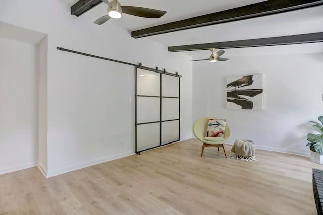 10206 Cripple Creek Cv, Austin, TX 78758 - living area featuring a ceiling fan, a barn door, wood finished floors, and beamed ceiling