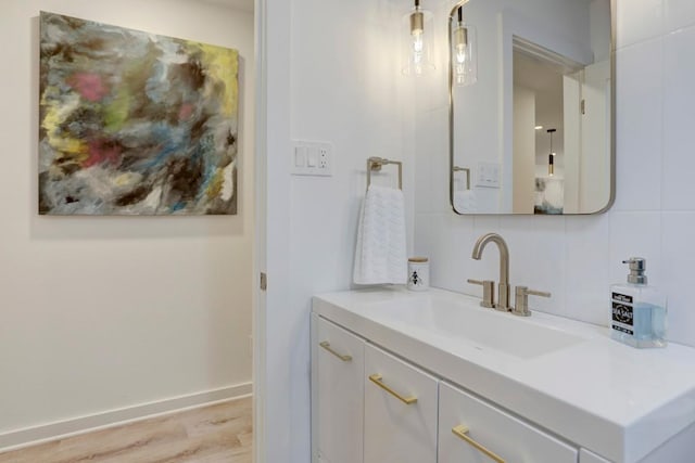 10206 Cripple Creek Cv, Austin, TX 78758 - bathroom featuring vanity and wood finished floors