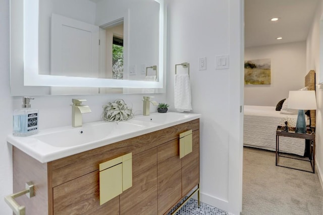 10206 Cripple Creek Cv, Austin, TX 78758 - bathroom featuring double vanity, connected bathroom, and recessed lighting