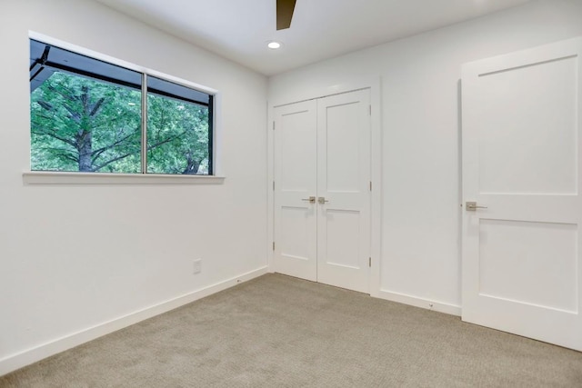 10206 Cripple Creek Cv, Austin, TX 78758 - unfurnished bedroom with light carpet, a closet, ceiling fan, and recessed lighting