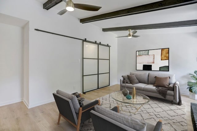10206 Cripple Creek Cv, Austin, TX 78758 - living area featuring ceiling fan, a barn door, light wood-type flooring, and beamed ceiling