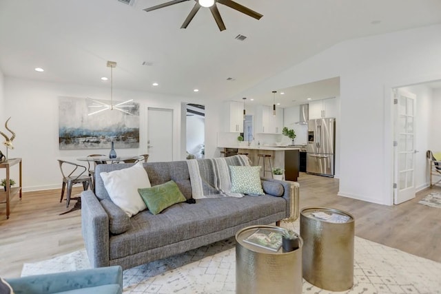 10206 Cripple Creek Cv, Austin, TX 78758 - living room with ceiling fan, light wood-style flooring, lofted ceiling, and recessed lighting