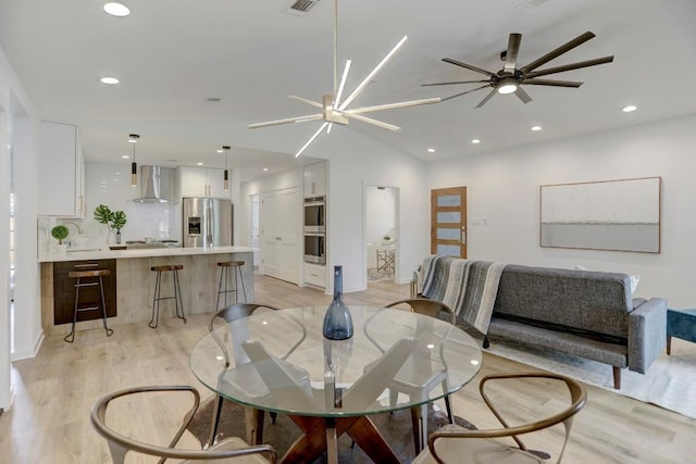 10206 Cripple Creek Cv, Austin, TX 78758 - dining area with light wood-style floors, ceiling fan, recessed lighting, and lofted ceiling
