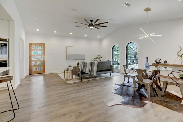 10206 Cripple Creek Cv, Austin, TX 78758 - dining area featuring a ceiling fan, light wood-style floors, recessed lighting, and vaulted ceiling