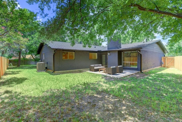 10206 Cripple Creek Cv, Austin, TX 78758 - back of property featuring an outdoor hangout area, brick siding, a chimney, a fenced backyard, and a patio