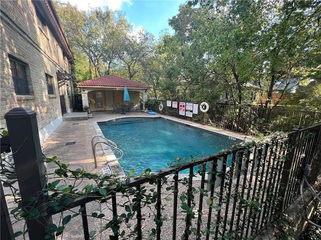 407 E 45th St Unit 108, Austin, TX 78751 - community pool with a patio and an outbuilding