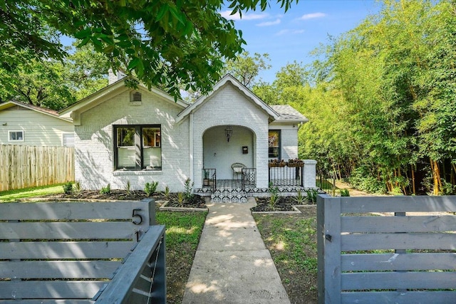 510 E 38th St, Austin, TX 78705 - bungalow-style home with brick siding and a porch