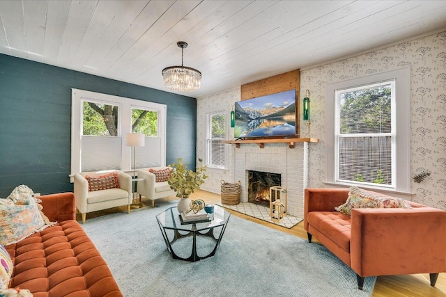 510 E 38th St, Austin, TX 78705 - living area with healthy amount of natural light, wallpapered walls, a brick fireplace, a chandelier, and wood ceiling