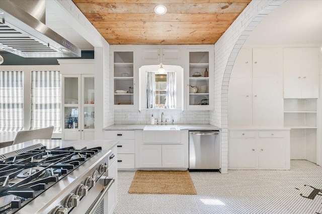 510 E 38th St, Austin, TX 78705 - kitchen featuring appliances with stainless steel finishes, wall chimney exhaust hood, wooden ceiling, white cabinets, and backsplash