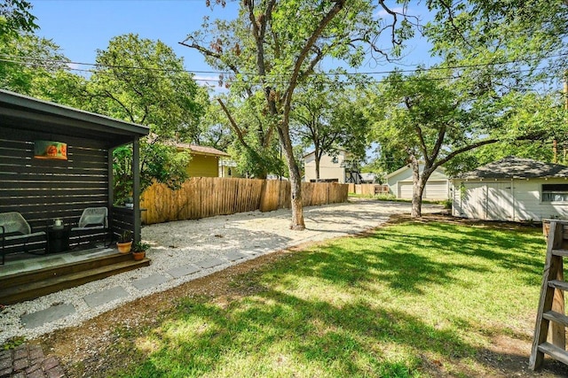510 E 38th St, Austin, TX 78705 - view of yard featuring a detached garage and a patio area