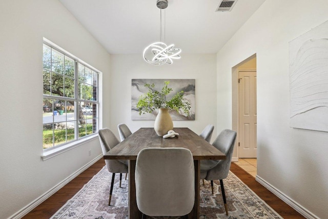 2807 Glenwood Trl, Cedar Park, TX 78613 - dining area with a chandelier, plenty of natural light, and dark wood-style flooring