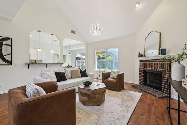 2807 Glenwood Trl, Cedar Park, TX 78613 - living area with a fireplace, wood finished floors, high vaulted ceiling, and a chandelier