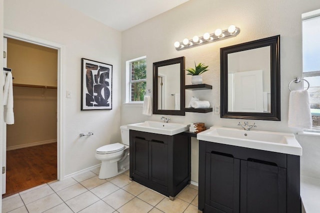 2807 Glenwood Trl, Cedar Park, TX 78613 - full bathroom featuring two vanities, a spacious closet, and tile patterned floors
