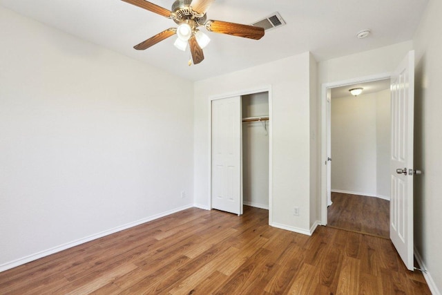 2807 Glenwood Trl, Cedar Park, TX 78613 - unfurnished bedroom with wood finished floors, a closet, and ceiling fan