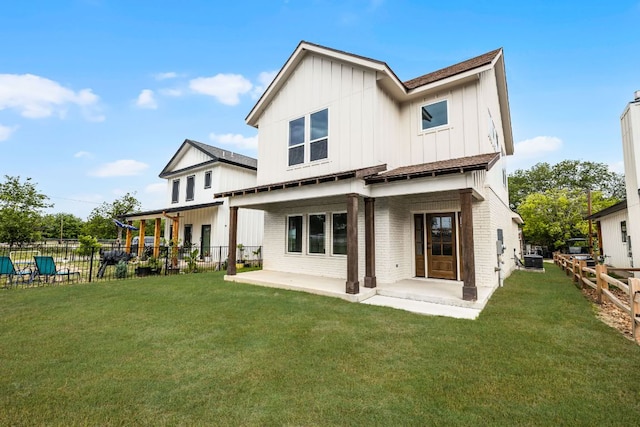 182 W Torrey St, New Braunfels, TX 78130 - rear view of property with board and batten siding, a patio, and brick siding