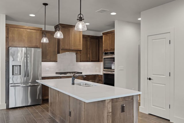 182 W Torrey St, New Braunfels, TX 78130 - kitchen featuring stainless steel appliances, recessed lighting, light countertops, tasteful backsplash, and wood tiled floors